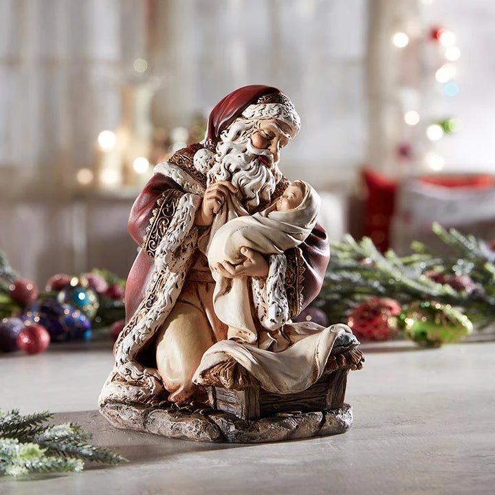 1. Adoring Santa with Baby Jesus figurine for mantel, shelf, tabletop, and faith-centered Christmas décor.