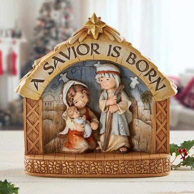 Childlike Catholic Nativity figurine featuring A Savior is Born across the stable.