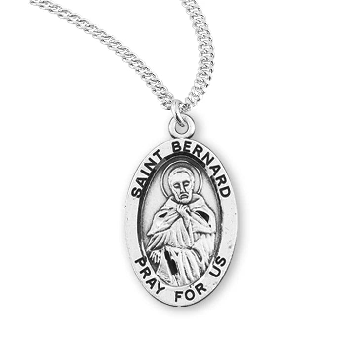 Patron Saint Bernard Oval Sterling Silver Medal featuring Saint Bernard holding a cross, in a detailed oval design.