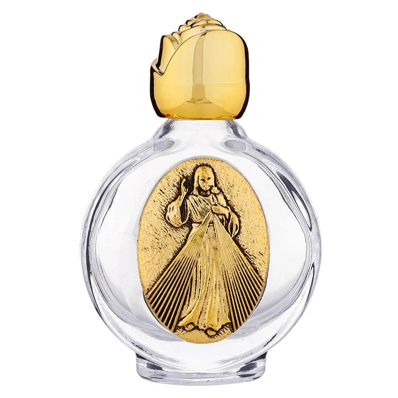 Catholic holy water glass bottle display featuring Divine Mercy design.