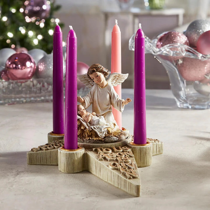 Star-shaped Advent candle holder with four candle spaces and Nativity angel centerpiece for Catholic Christmas displays.